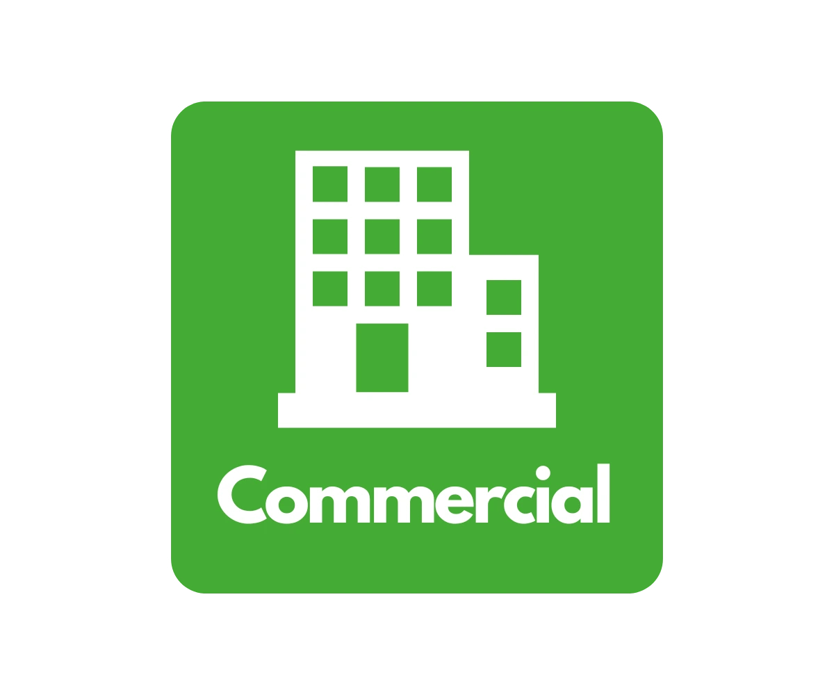 Commercial logo with a white building against a green background